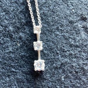 Necklace. Silver in color with 3 stones